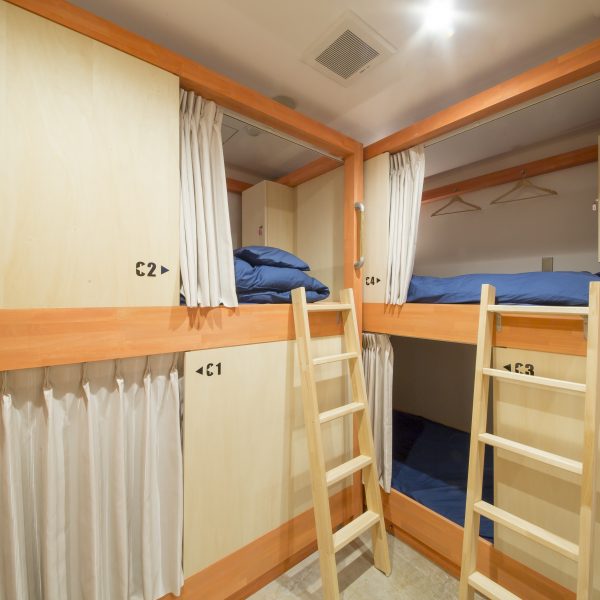 individual bunks in shared guesthouse rooms at Kaname Hostel