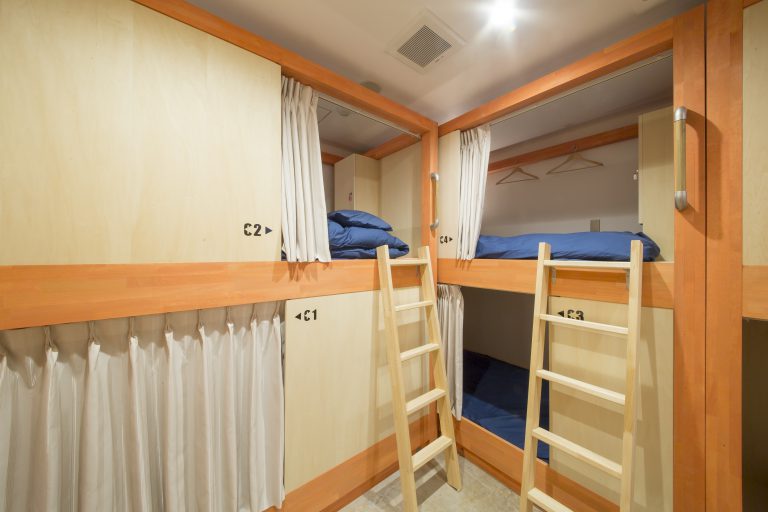 individual bunks in shared guesthouse rooms at Kaname Hostel