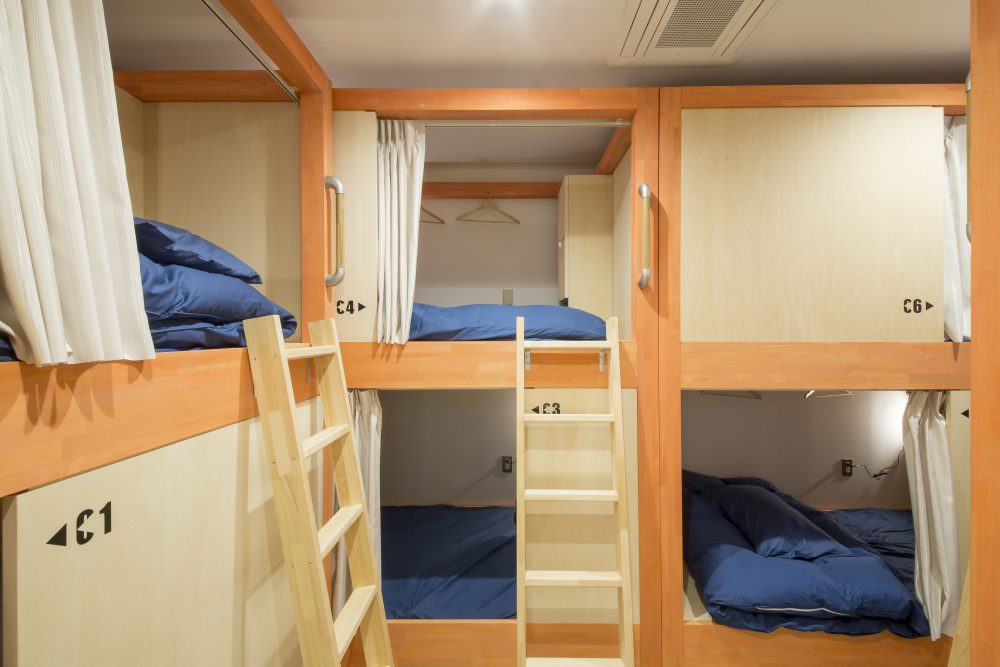roomier than a capsule hotel, large beds at hostel in Kanazawa