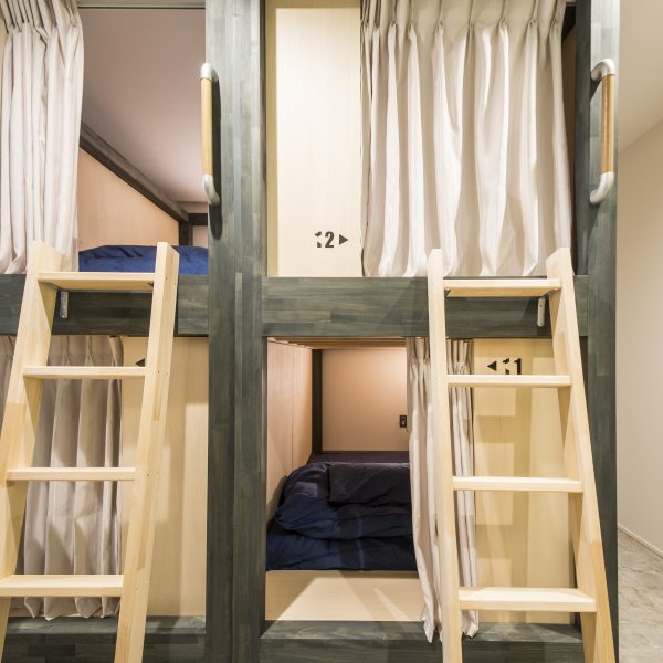 semi double bed bunks with privacy curtains and lights in kaname hostel, backpacker's resthouse