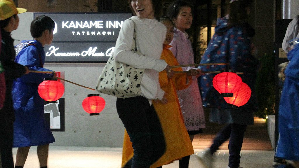 The Children's Lantern Parade passing in front of Kaname Inn Tatemachi, during the Hyakumangoku Festival in Kanazawa Japan
