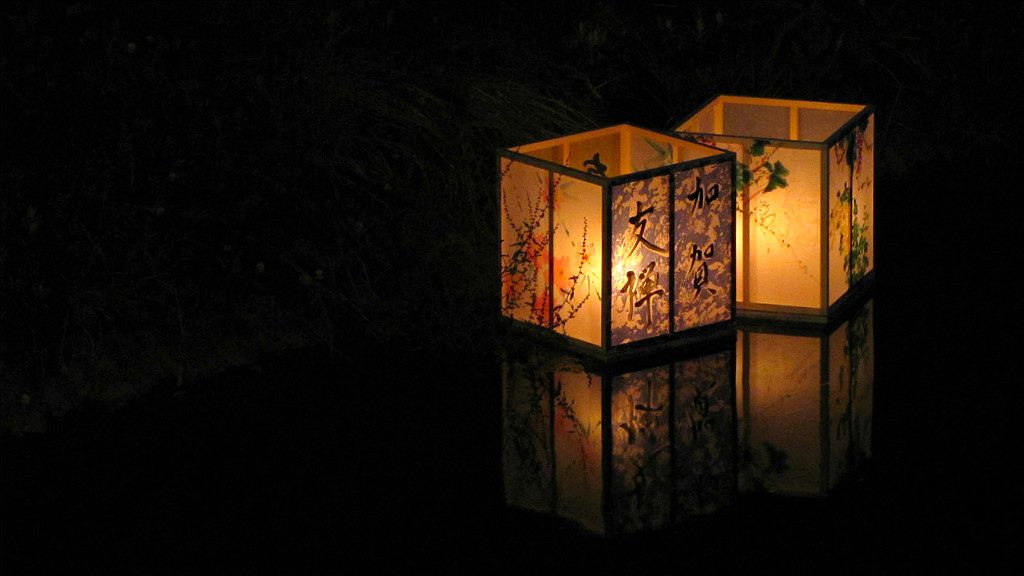 kaga yuzen lanterns float down the Asano River for Hyakumangoku Festival