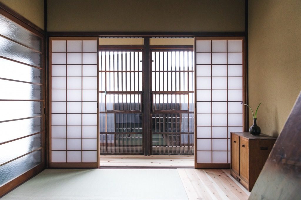 Paper windows called shoji and wood flooring are common in machiya homes