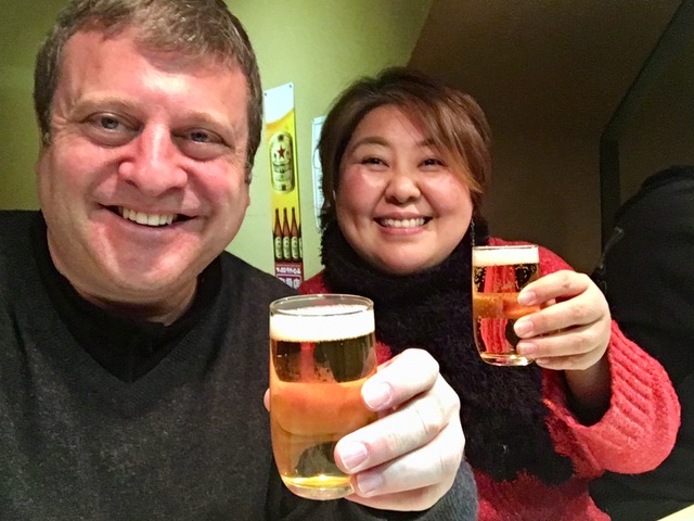 Andrew Blechman and friend Akiko sharing a beer in Kanazawa, Japan