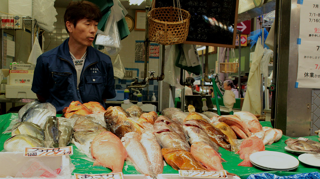 Fish seller at Omicho Market in Kanazawa, Japan