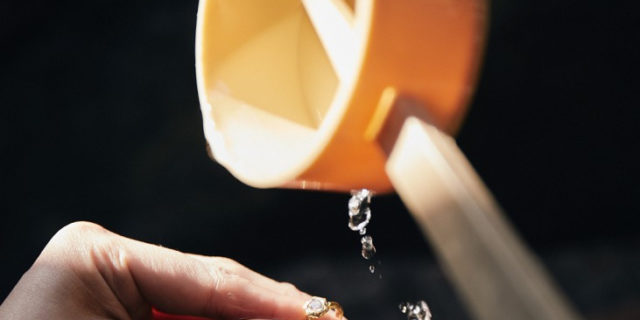 Water from the shrine at Natadera, poured over hands to purify