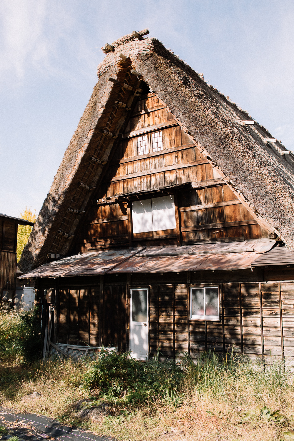 Gassho style farmhouse in partial shade at Shirakawa-go