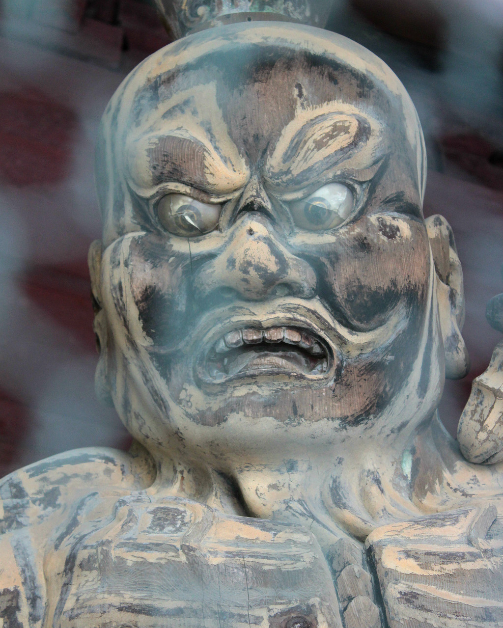 One of the giant guardians at the gate of Tentokuin, the Princess Temple in Kanazawa, Japan