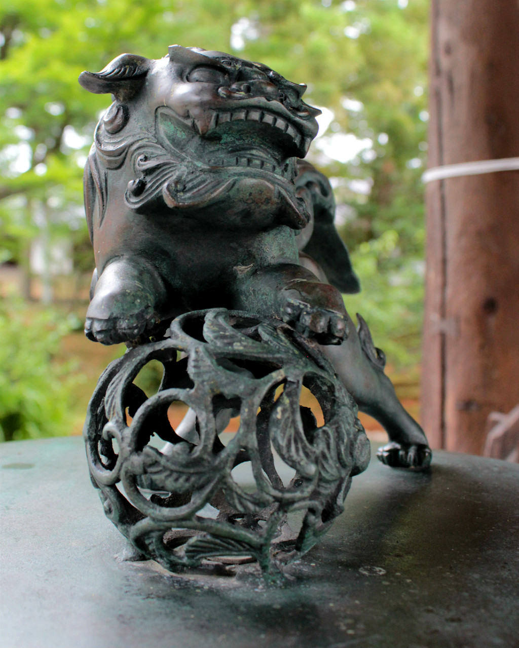 A playful lion guardian at the entrance to Tentokuin, the Princess Temple in Kanazawa, Japan