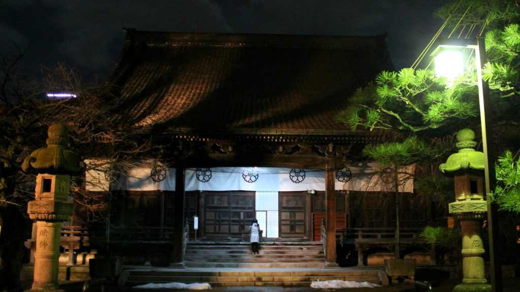 Zuisenji's hall was closed, yet visitors still came to pray on New Years Eve in Kanazawa, Japan
