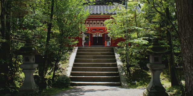 The canopied stairway to the vermillion pained Kanazawa Shrine.