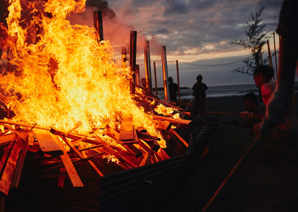 Noyaki, the wild fire kiln, turns into a bonfire after sunset.