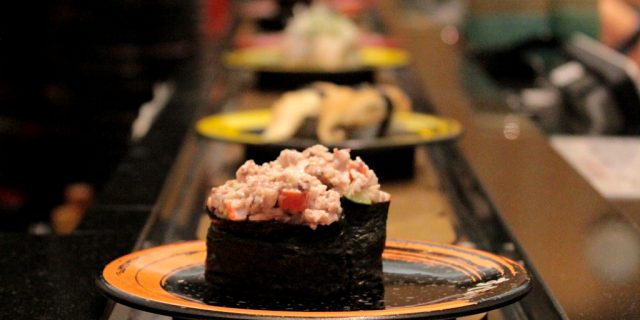 Sushi on conveyor belt, sushi train at Kuine in Kanazawa, Japan