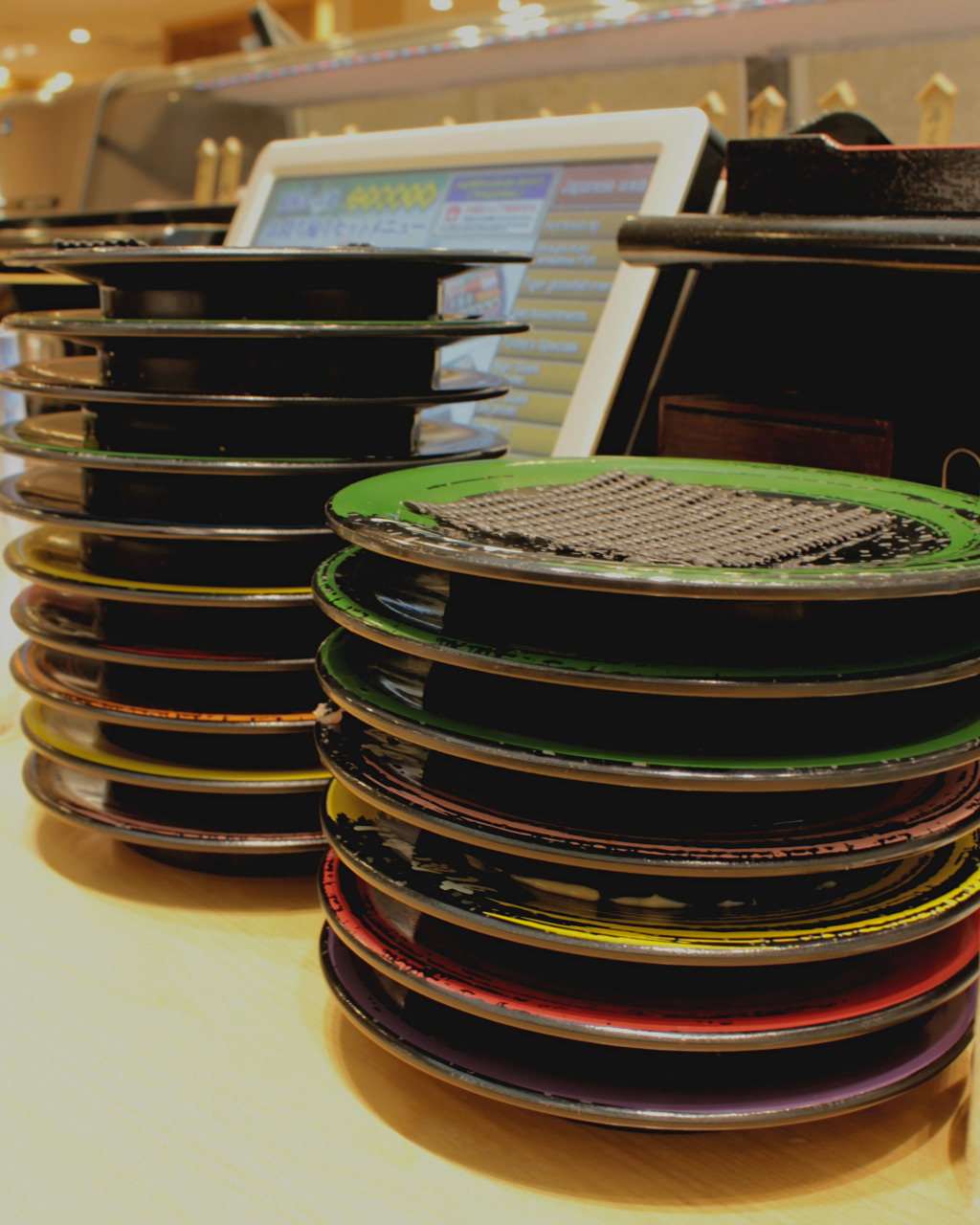 Stacks of eaten sushi at Kuine in Kanazawa, Japan