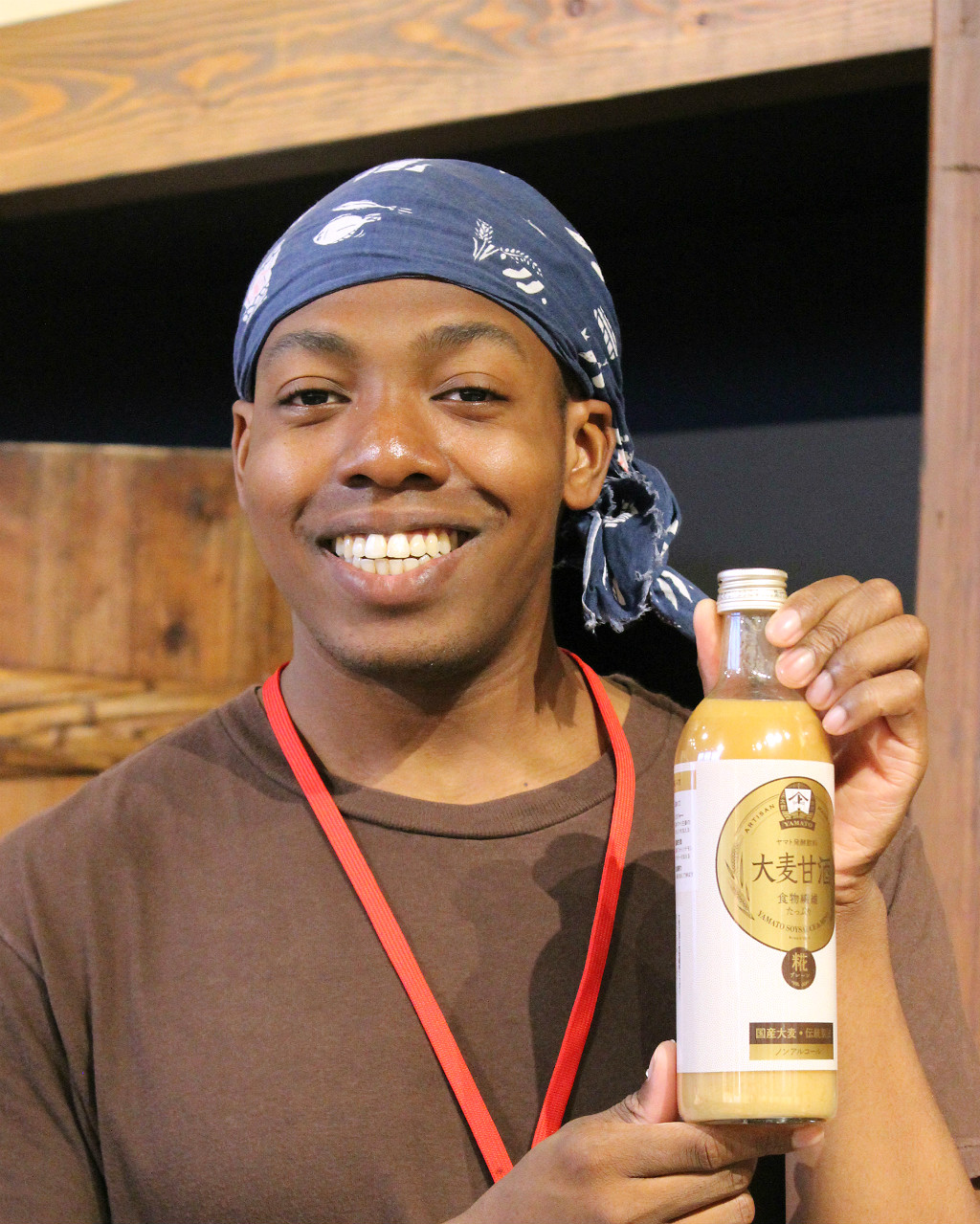 Patrick Okwuosa with his favorite kouji product, barely amazake, at Yamato Soysauce and Miso Company's Kouji Park in Onomachi, Kanazawa.