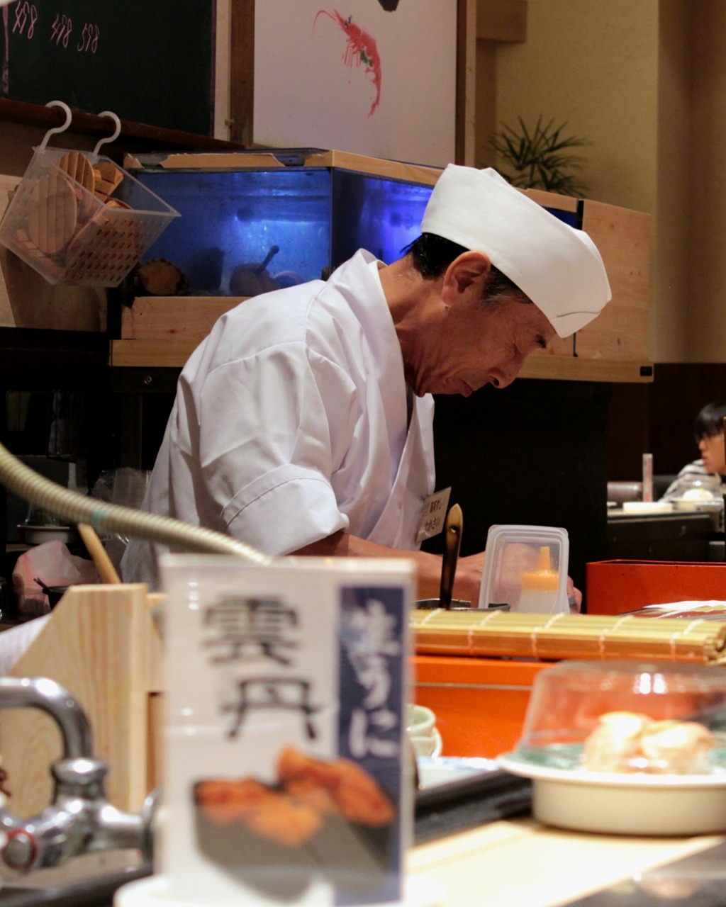 Chef at Kaiten Sushi, a sushi train chain in Kanazawa, Japan