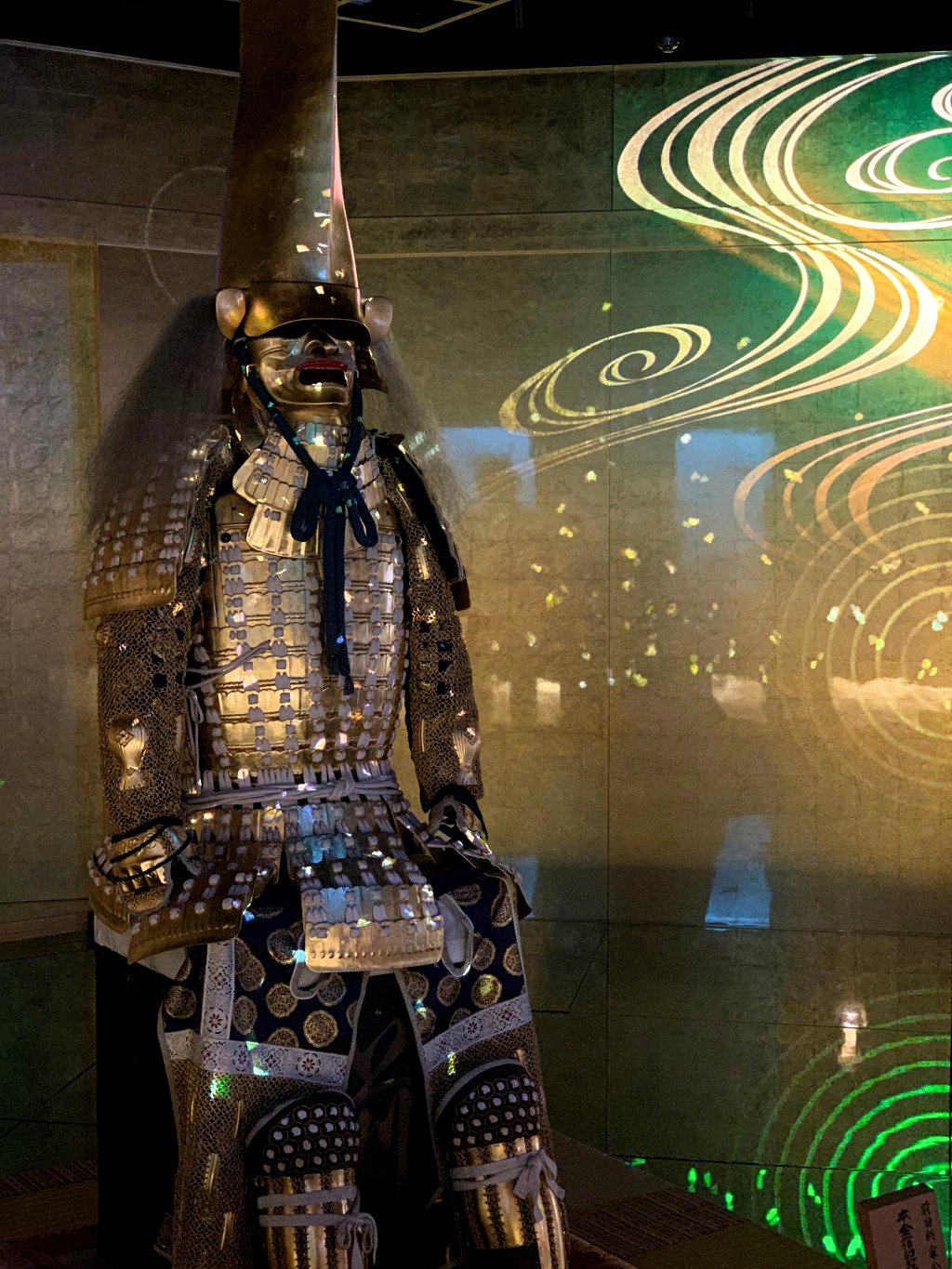 Golden samurai armor light show at Hakuichi Kakukoukan in Kanazawa