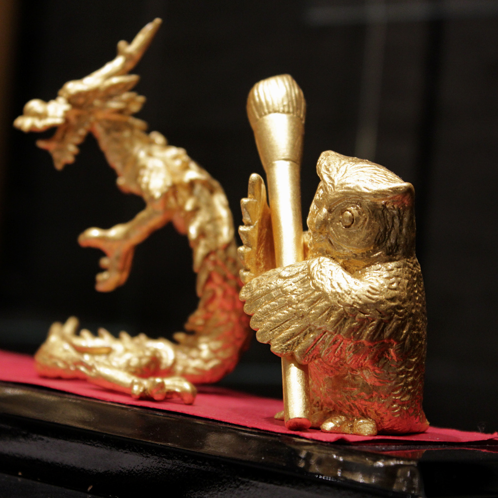 Kanazawa gold foil owl and dragon brush holders to help you with your calligraphy.