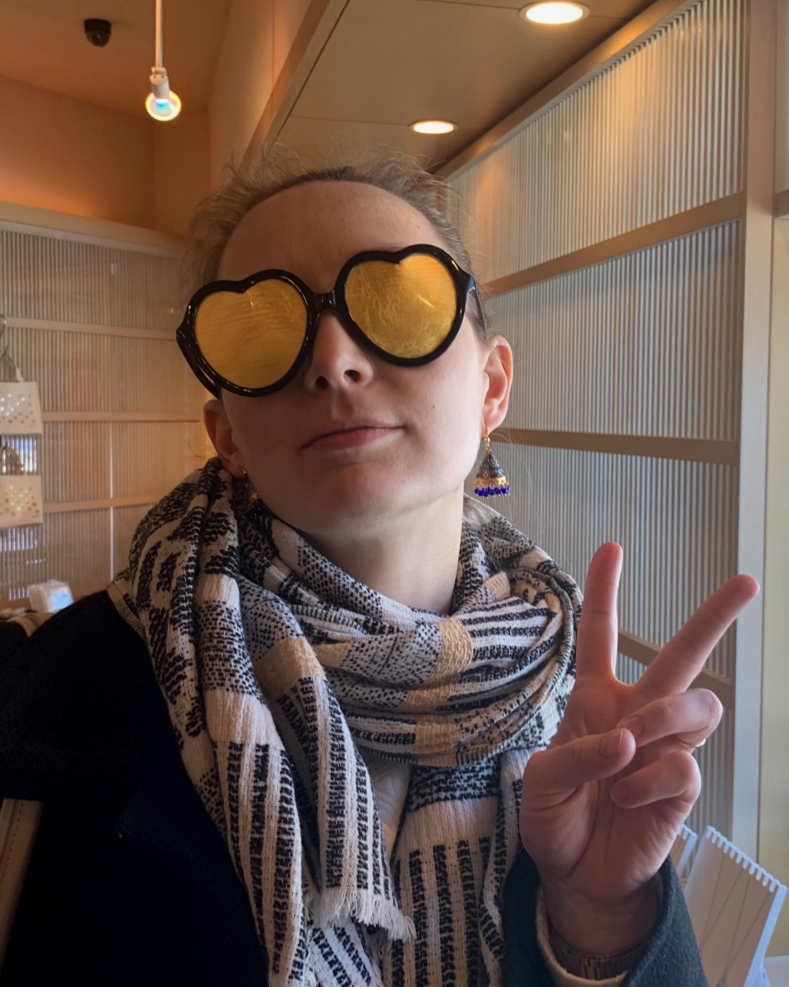 Jess wearing gold leaf glasses at Imai Kinpaku in Kanazawa