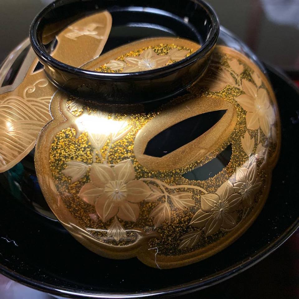 A makie lacquerware bowl decorated with tsuba, the guards of Japanese swords, at Tsubajin in Kanazawa