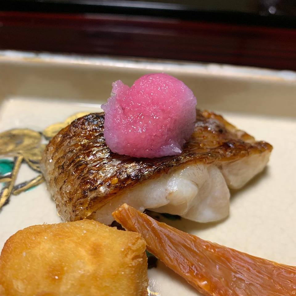 Color-changing daikon on top of delicate fish dish at Tsubajin in Kanazawa