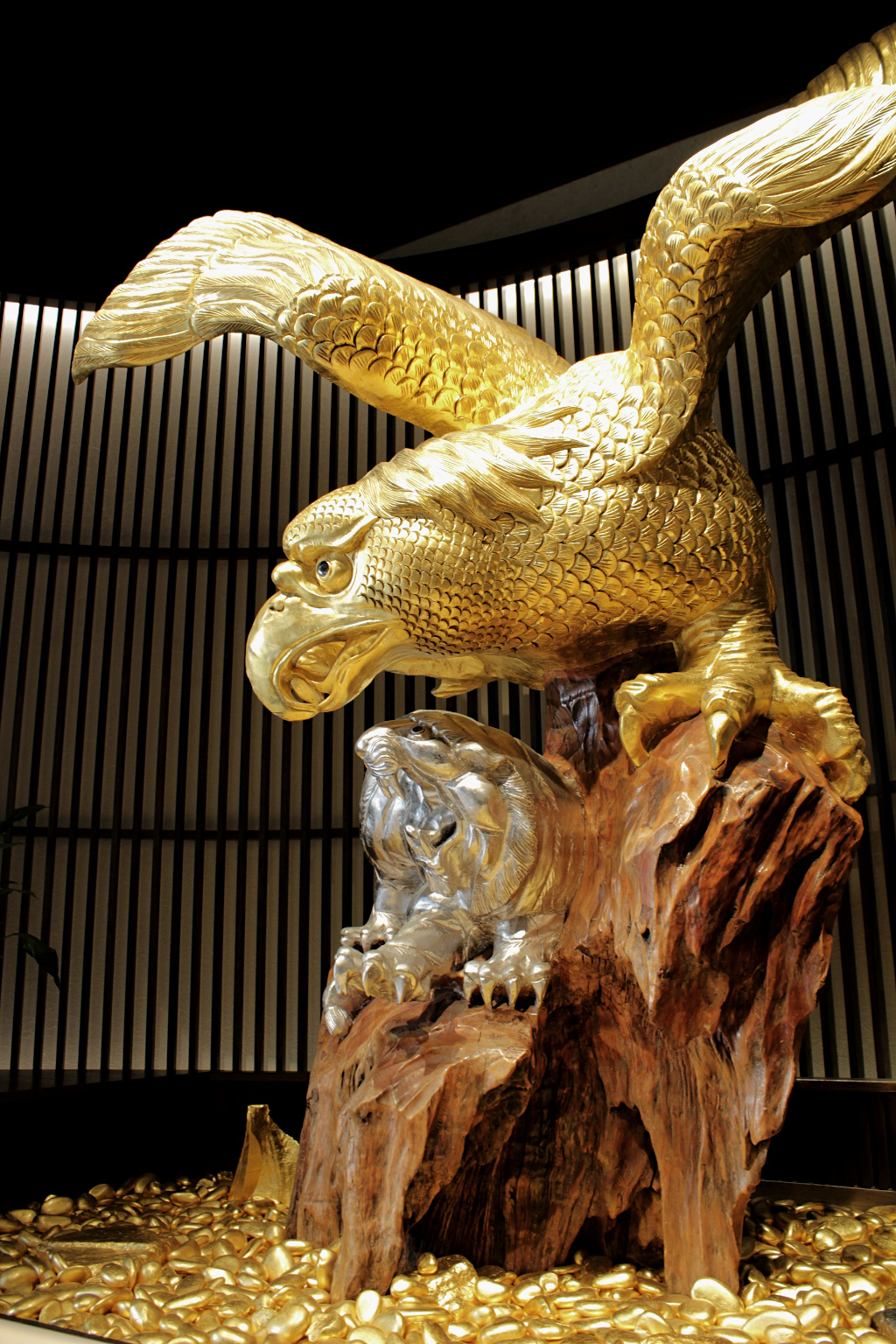 A massive wooden statue of an eagle and tiger fighting, treated with gold and silver foil application techniques of Kanazawa, a the Sakuda store in the Higashi Chaya geisha district in Kanazawa