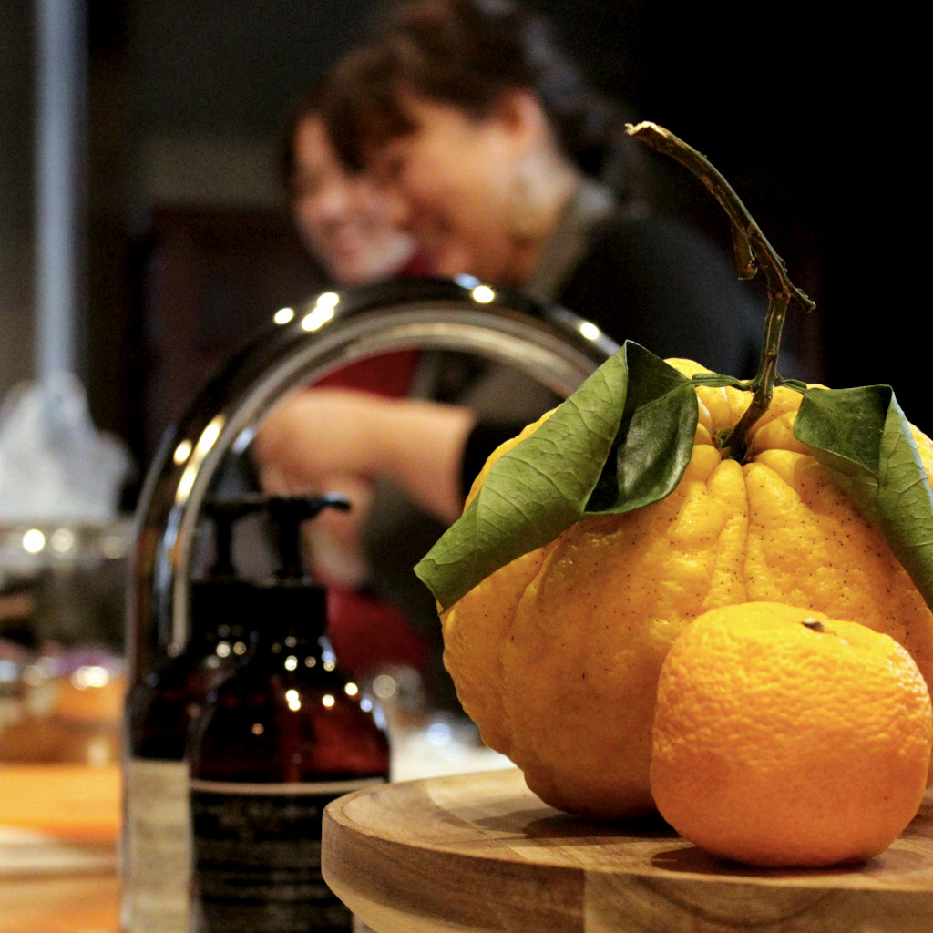 The view from my seat in Naoko's kitchen let's me see the Japanese chef smile aginst the scent of yuzu