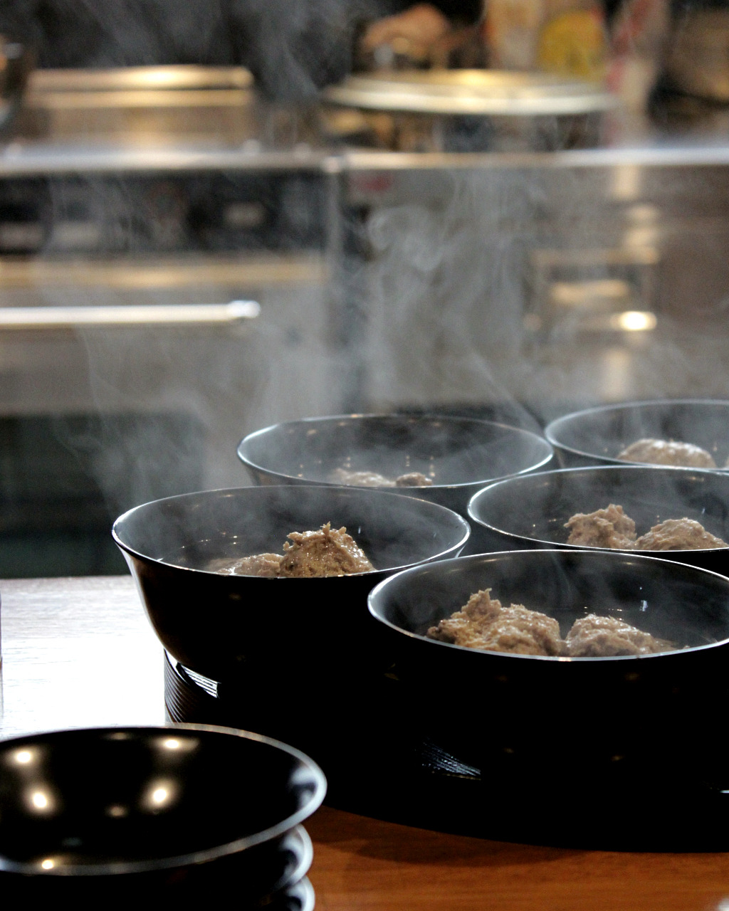 freshly cooked fish cake dumplings in dashi