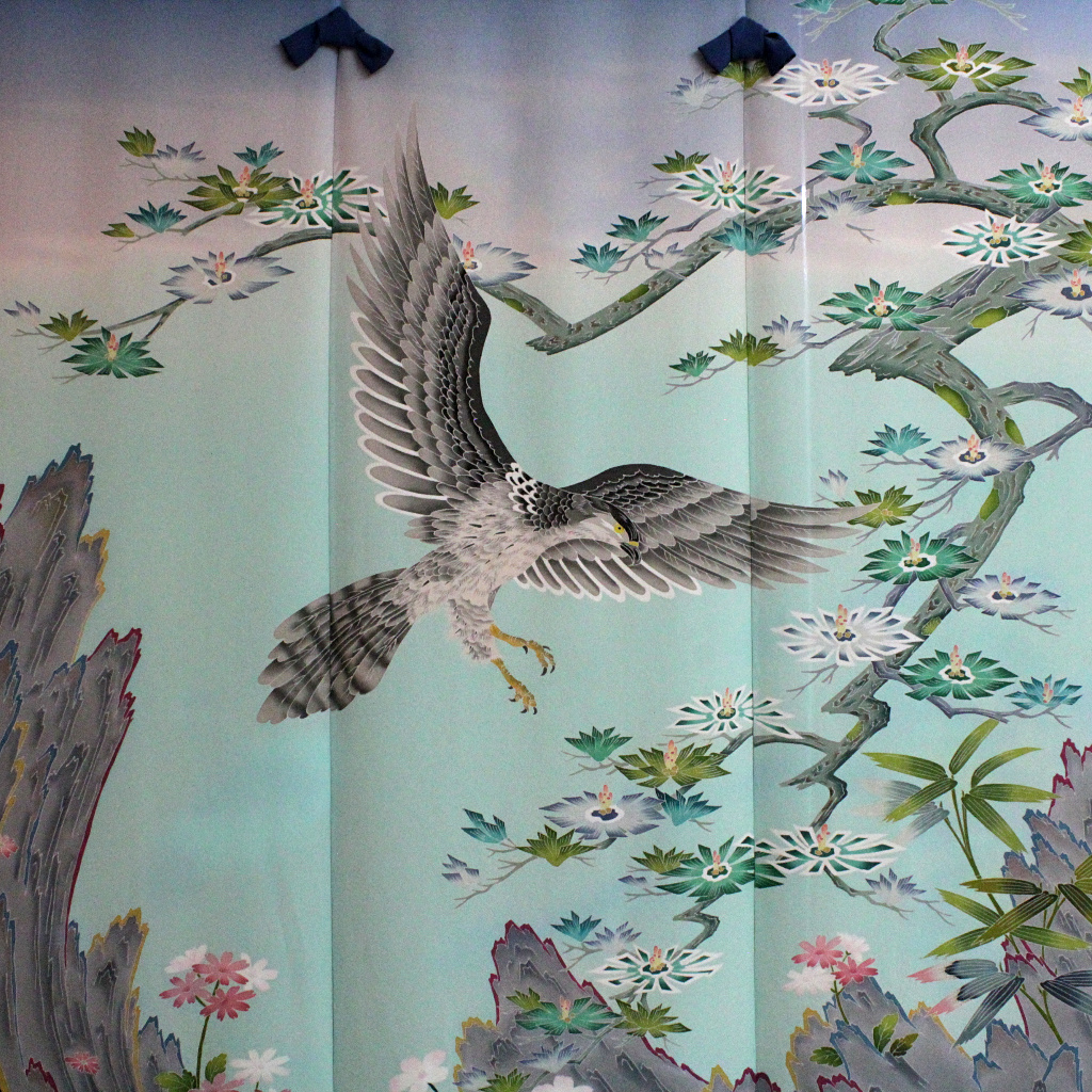 a noren, or door curtain, of Kaga-yuzen silk, painted with a hawk