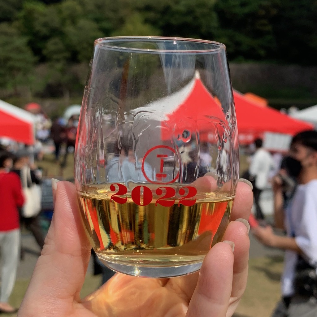 A glass of golden 20-year-old sake at Sake Marche in Kanazawa