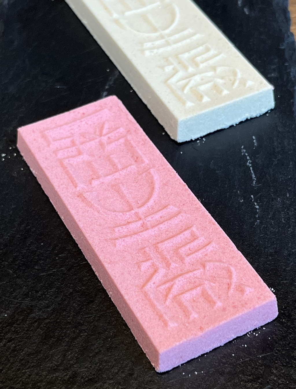 pink and white "Choseiden" rakugan candies shaped like blocks of calligraphy